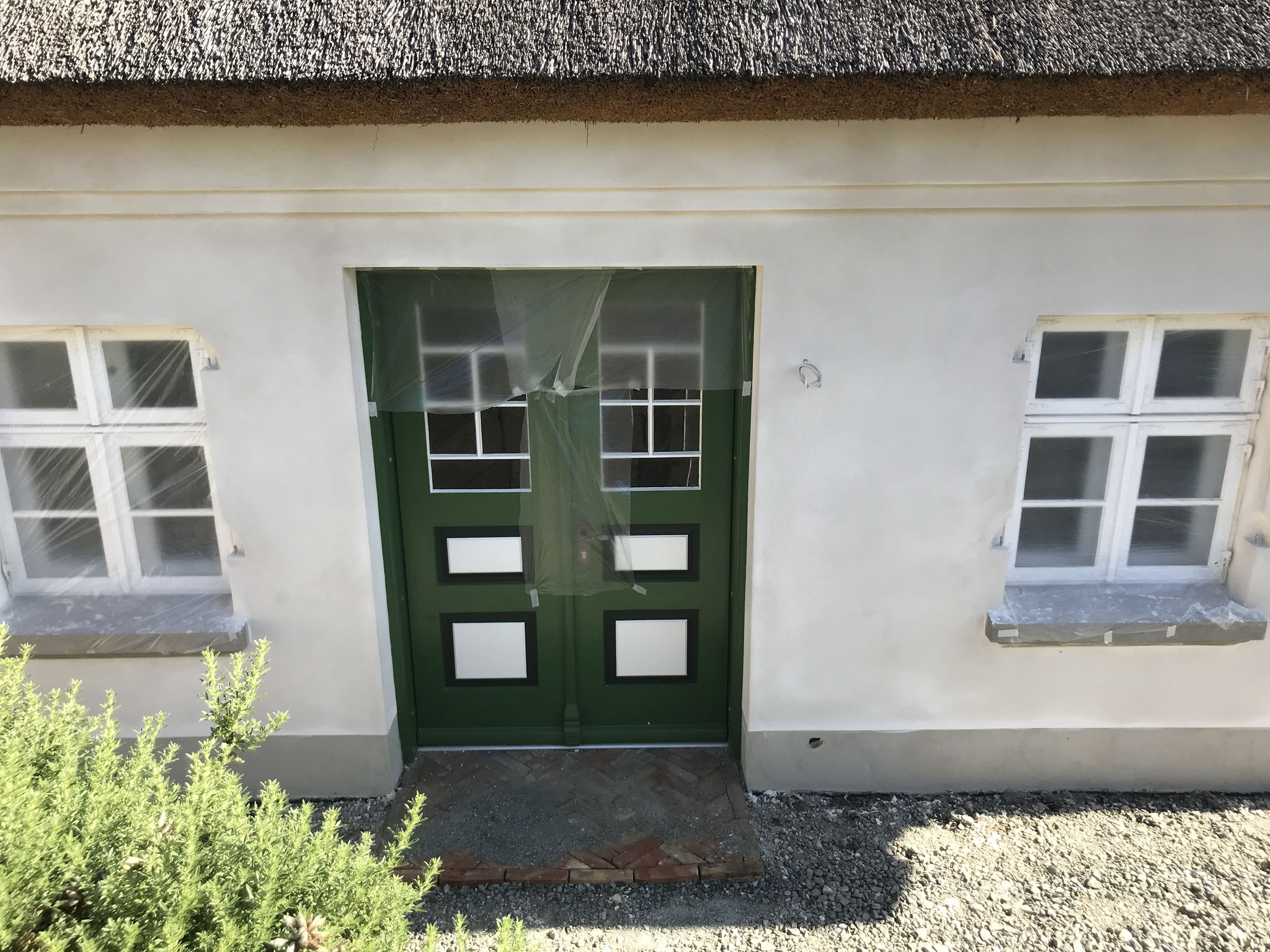 Lehmputz-Fassade-Reetdachhaus